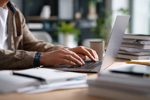 a_20_man_typing_on_his_laptop (1)