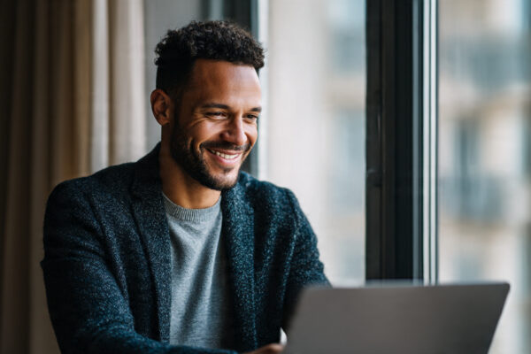 a_man_early_30s_closing_a_laptop(2)